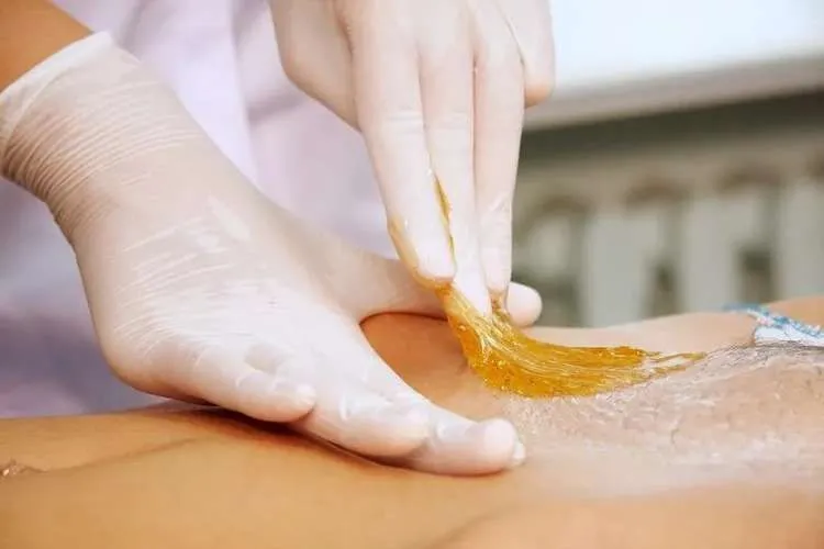 a chic brooklyn waxing studio interior showcases a modern, minimalist aesthetic, featuring sleek treatment rooms with polished surfaces and warm lighting, emphasizing the confidence-boosting experience of a href=
