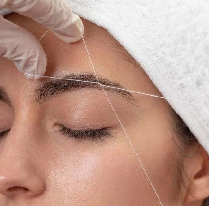 Professional eyebrow threading service for clean and defined brows