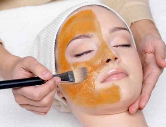 Nourishing vitamin C facial mask application for skin repair and radiance